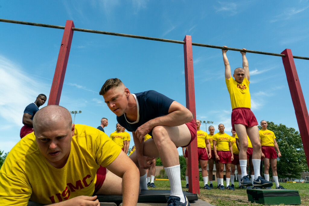Miles Heizer and cast during boot camp scene in Netflix’s BOOTS.
